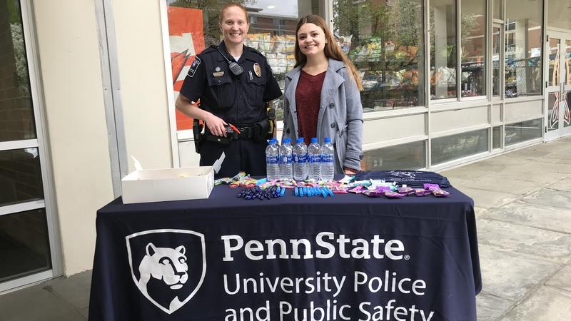 Officer and intern at event table
