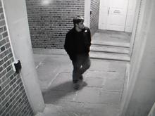 male standing outside of Thompson Hall 